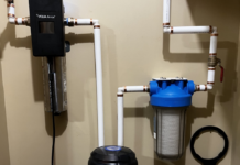 The water flow through the particulate filter on the right, into the charcoal filter (barely seen on the bottom) and then through the UV light for final purification.