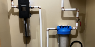 The water flow through the particulate filter on the right, into the charcoal filter (barely seen on the bottom) and then through the UV light for final purification.